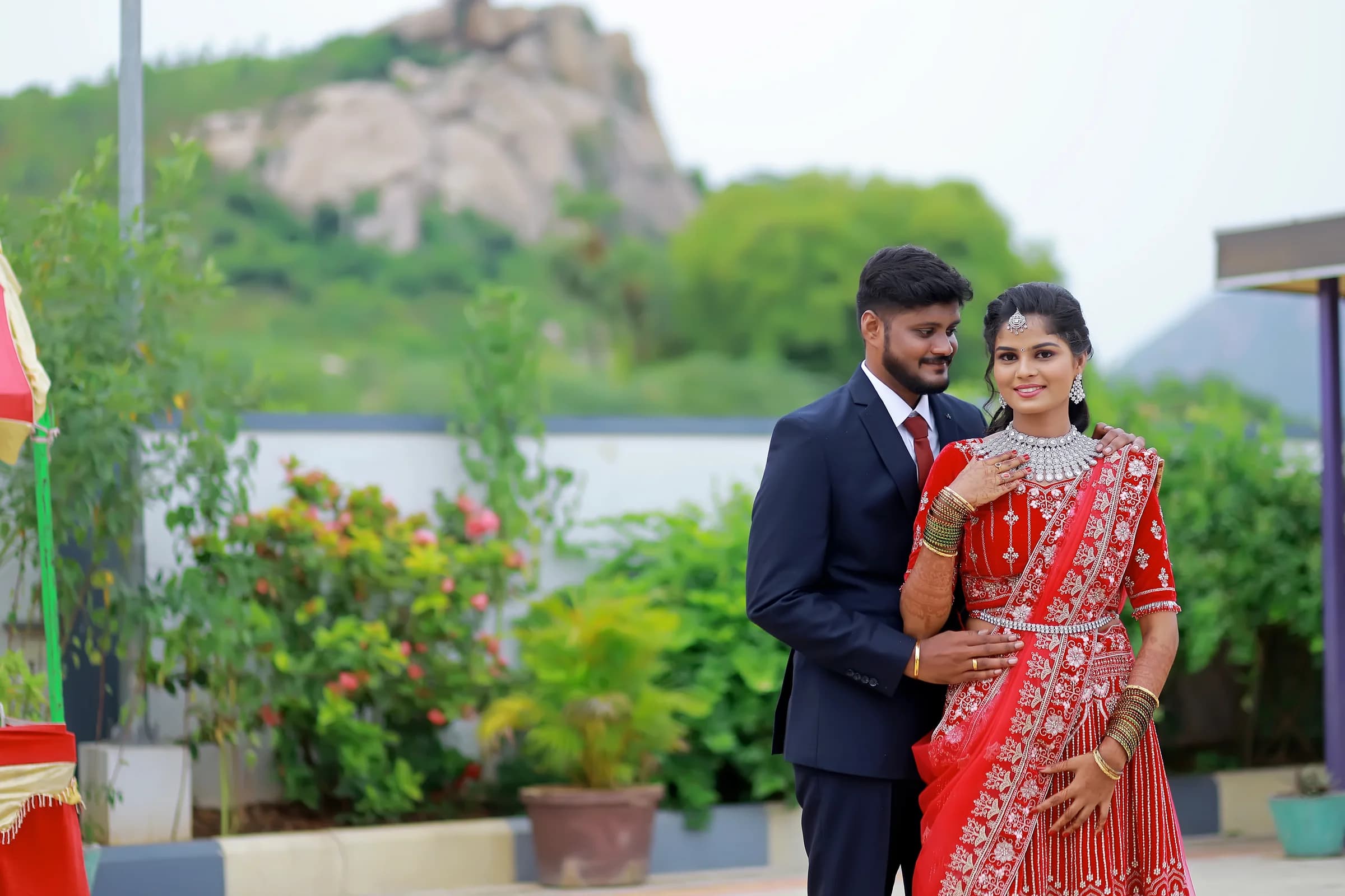 Wedding couple standing together outdoors